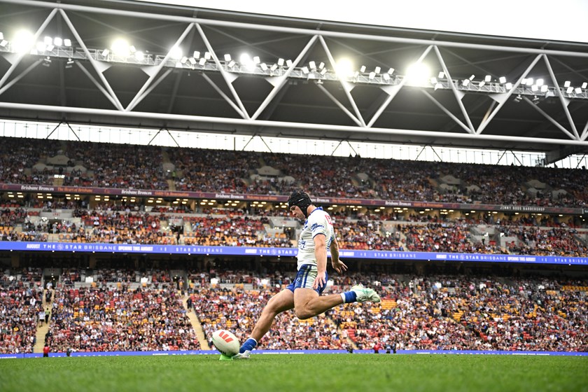 Matt Burton kicks for the Bulldogs against the Brisbane Broncos.