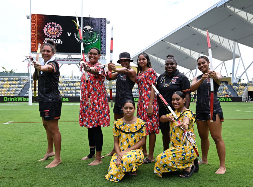 Tallisha Harden, Kimberley Hunt and Jasmine Peters with Torres Strait Island performers at captain's run.