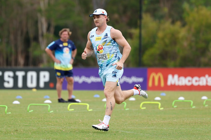 AJ Brimson at pre-season training while coach Des Hasler watches on.