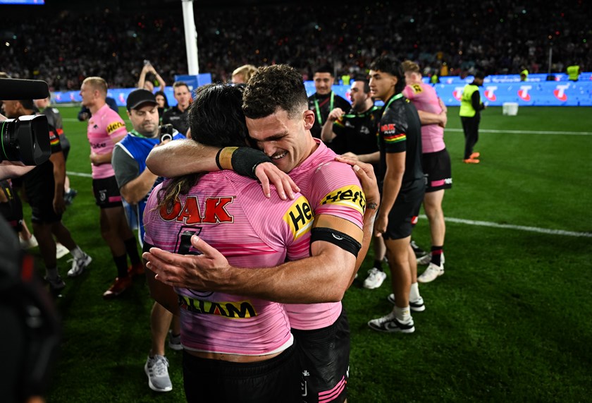 Jarome Luai and Nathan Cleary embrace following their grand final win.