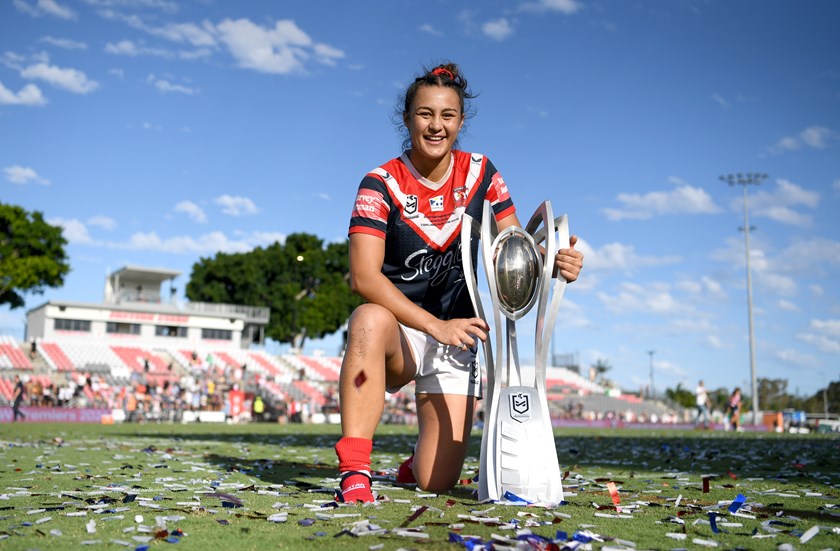 Corban Baxter with the NRLW trophy. 