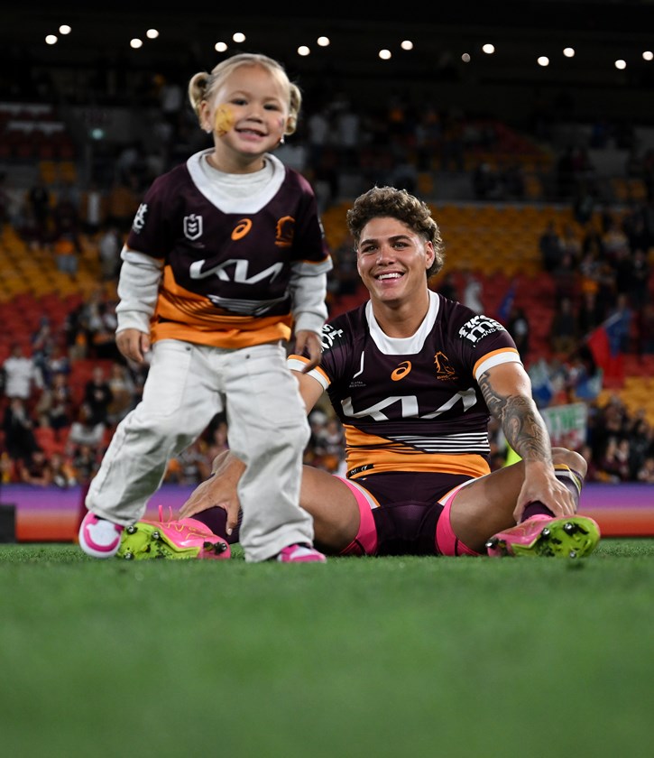 Reece Walsh and his daughter Leila after the Broncos' preliminary final win.