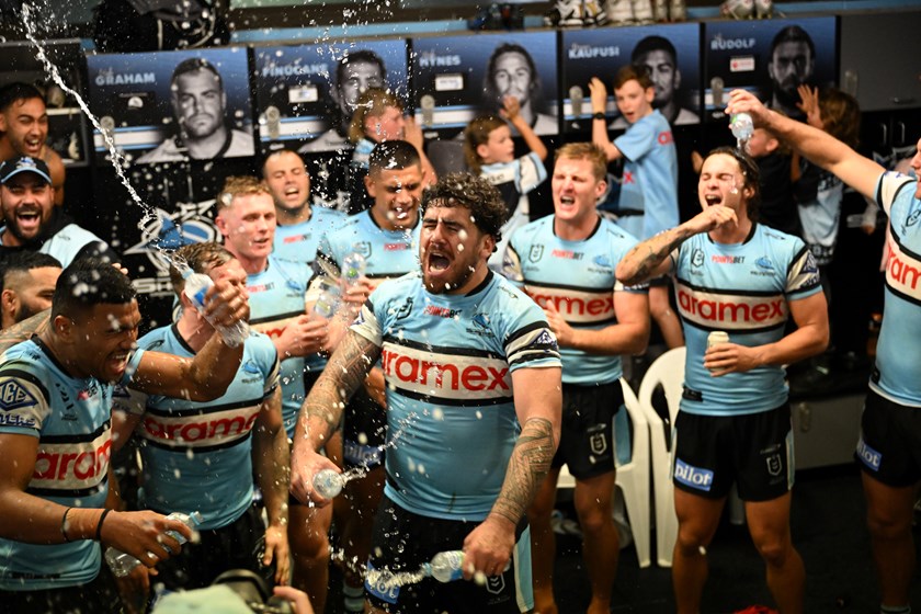 Braden Hamlin-Uele celebrates Cronulla's win over the Roosters.