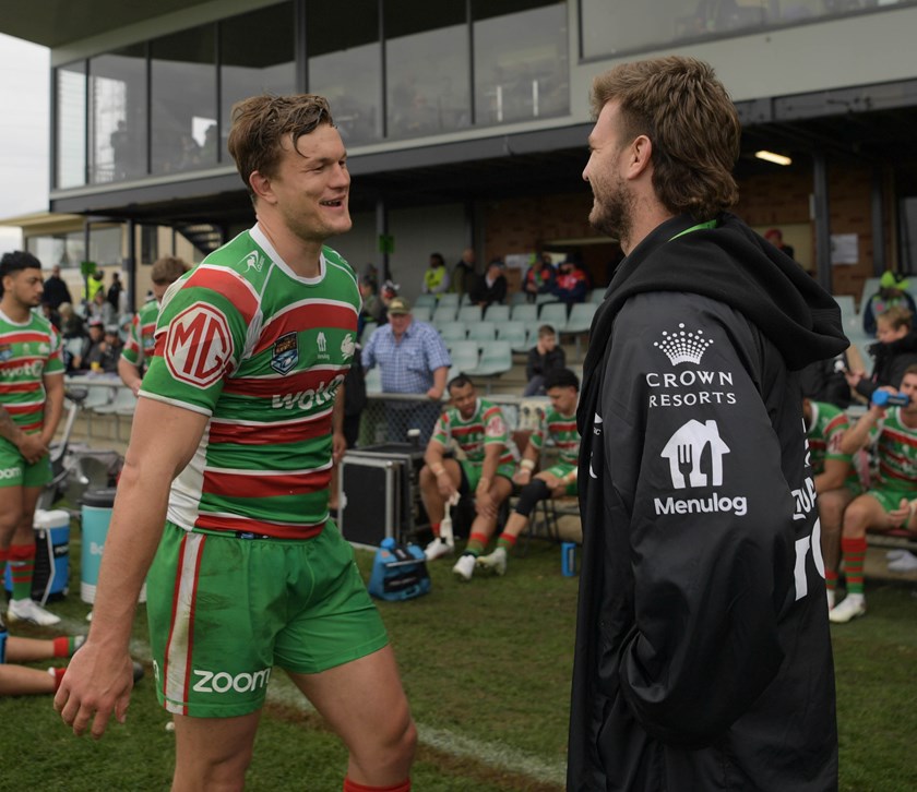 Jai Arrow congratulates Liam Knight on his return to the field. 