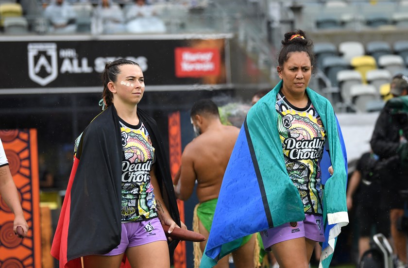 Quincy Dodd and Tallisha Harden lead out the Indigenous Women's All Stars team.