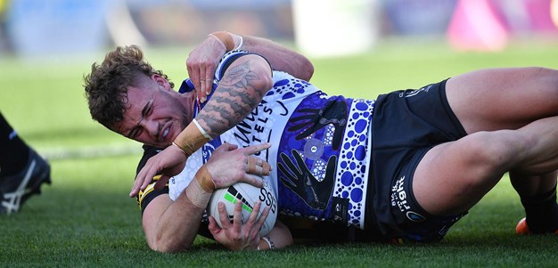 Meaney holds a ball up for Schoupp to get his first NRL try