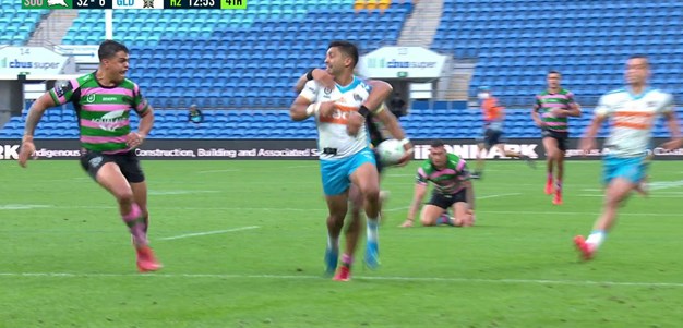 Paulo puts in a big effort to stop Peachey scoring