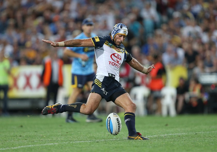 Johnathan Thurston kicks the winning field goal.