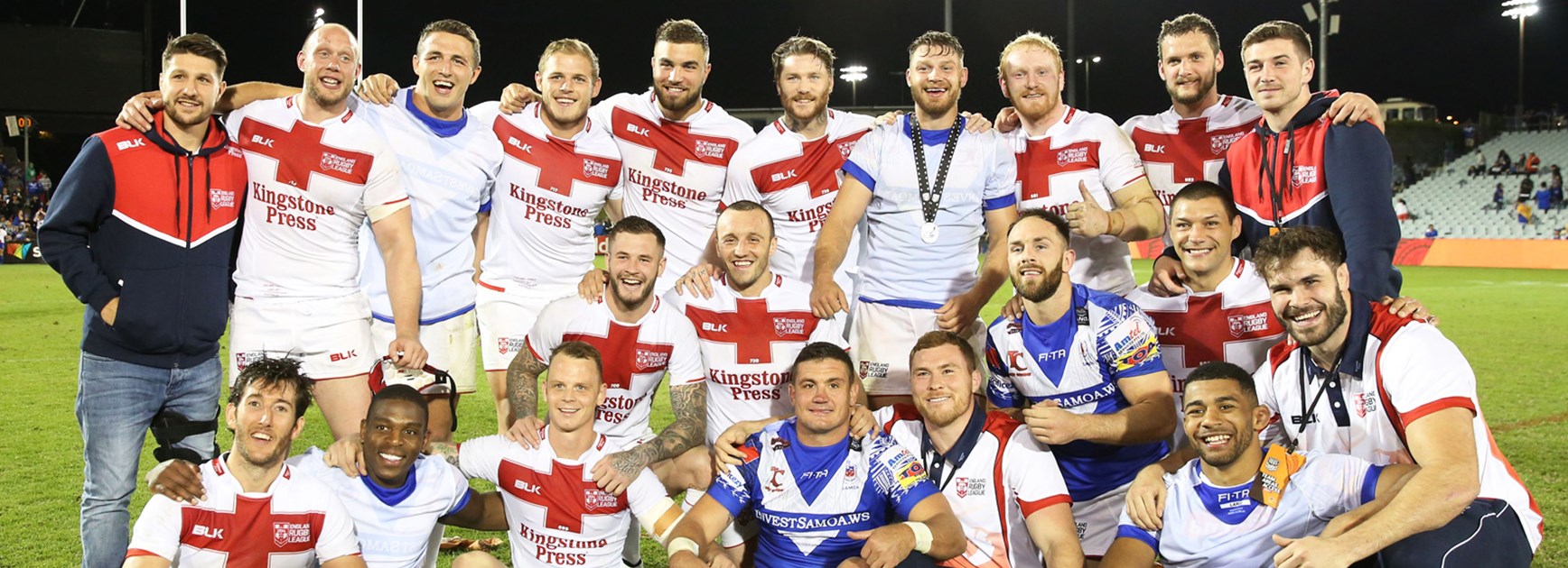 The England team celebrates their win over Samoa earlier this year.