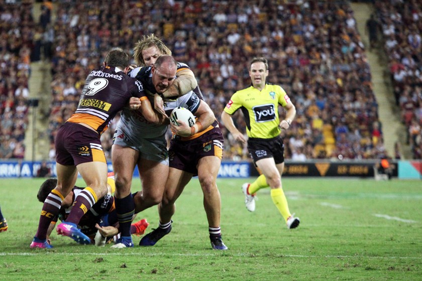 North Queensland Cowboys prop Matt Scott takes on the Broncos defence.