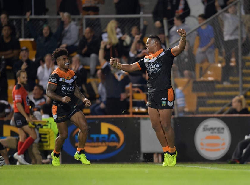 Moses Suli celebrates a try for the Wests Tigers in 2017.