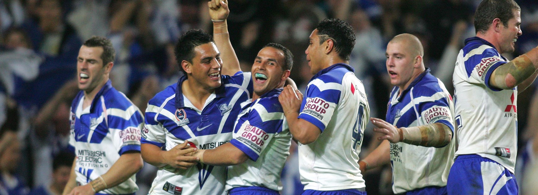 Bulldogs players celebrate.