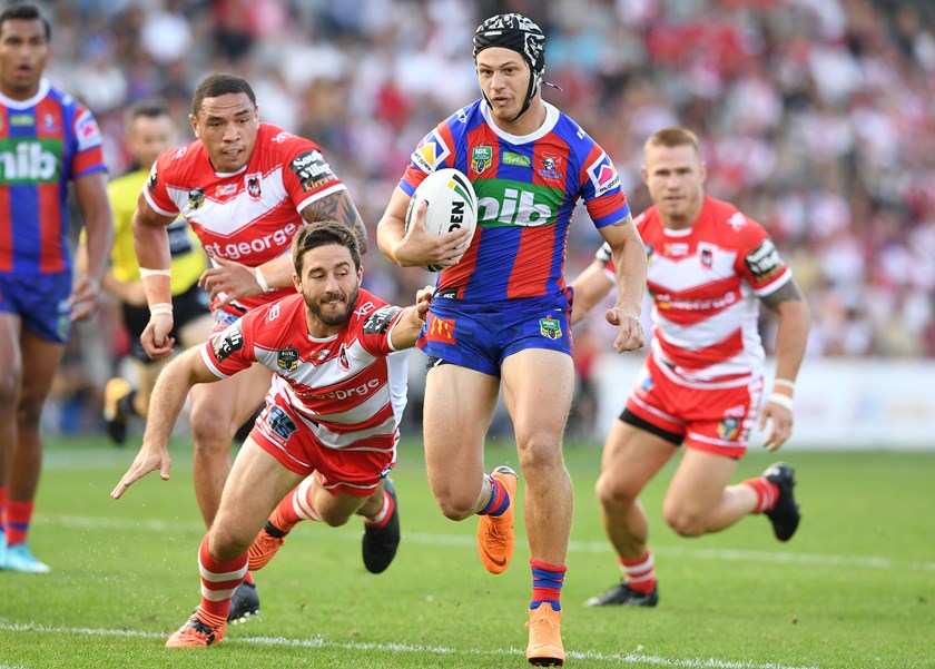 Kalyn Ponga evades Ben Hunt.