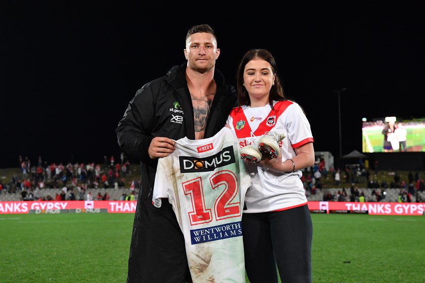 Tariq Sims presents his No.12 jersey to Lance Thompson's daughter Shalisse.