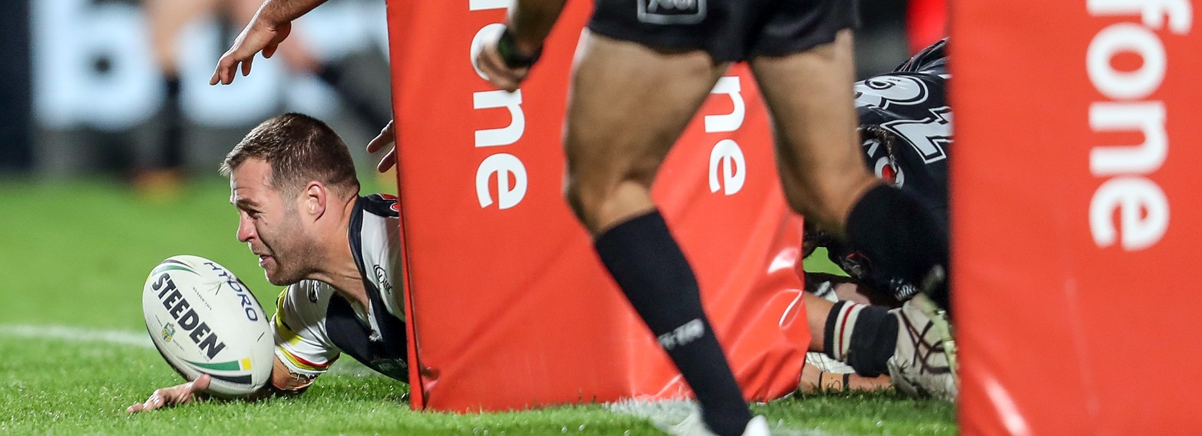 Panthers forward Trent Merrin sneaks in a try.