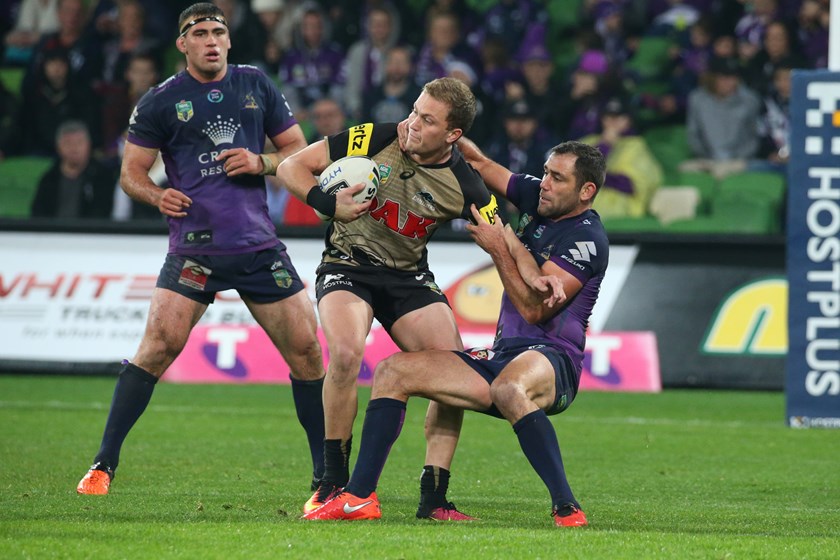 Matt Moylan tries to evade Cameron Smith at AAMI Park in 2016.