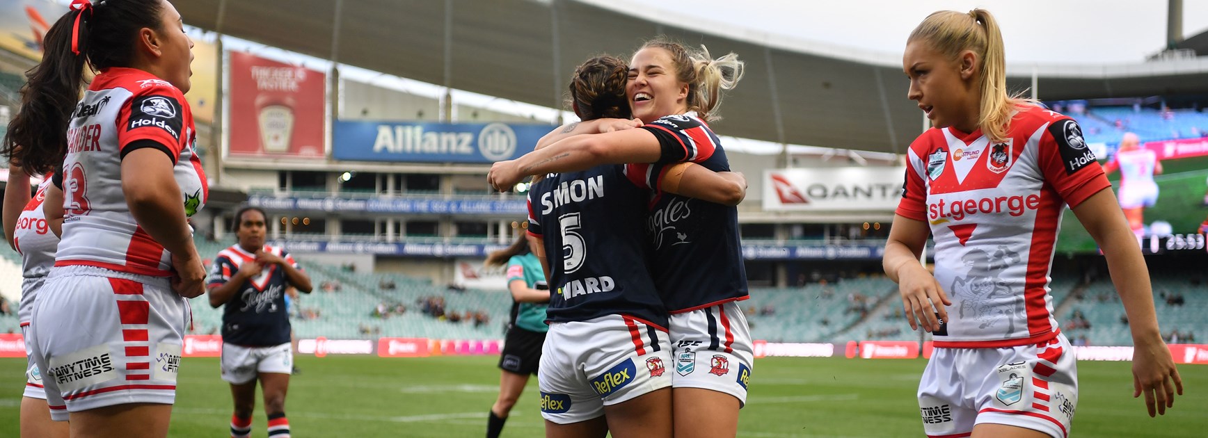 Roosters centre Isabelle Kelly celebrates a try.