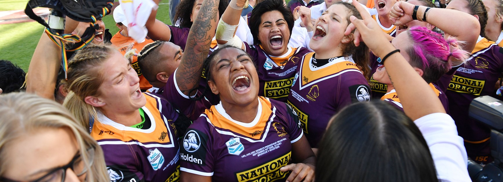 The Broncos celebrate their NRLW grand final win.