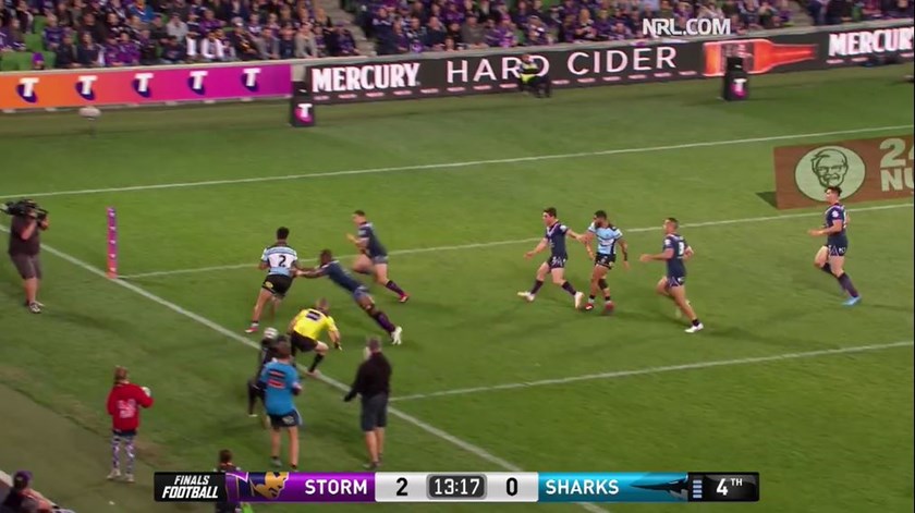 Billy Slater closes in on Sosaia Feki.