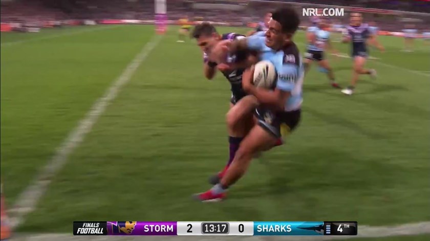 Billy Slater collides with Sosaia Feki.