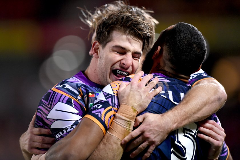 Storm centre Curtis Scott embraces teammate Josh-Addo-Carr.