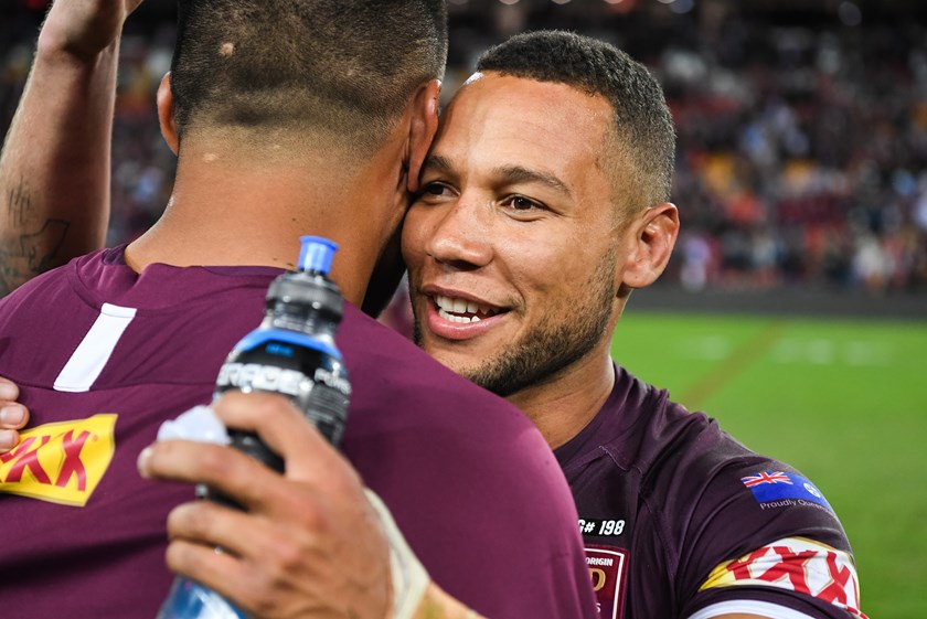 Moses Mbye celebrates Queensland's win.