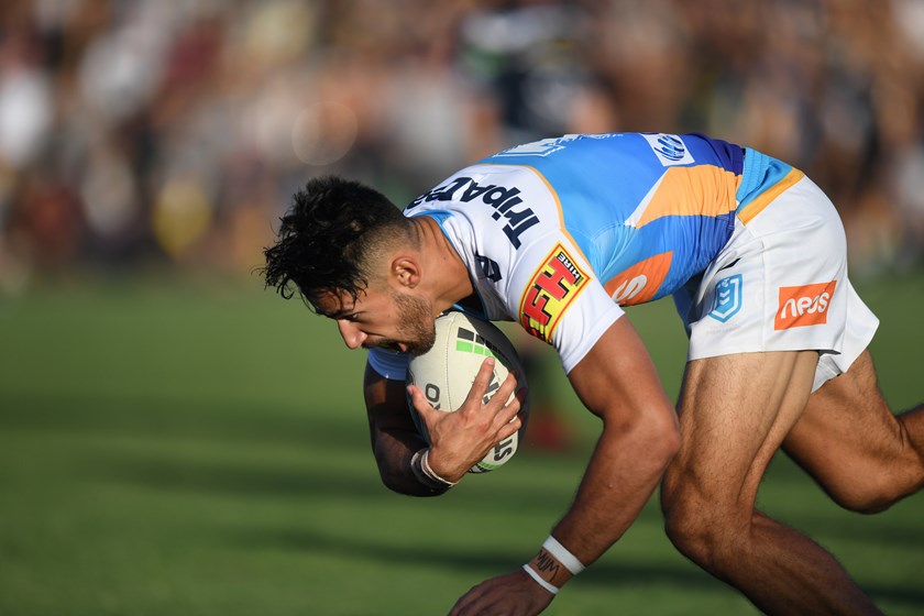 Titans fullback Jesse Arthars scores a try against the Cowboys.