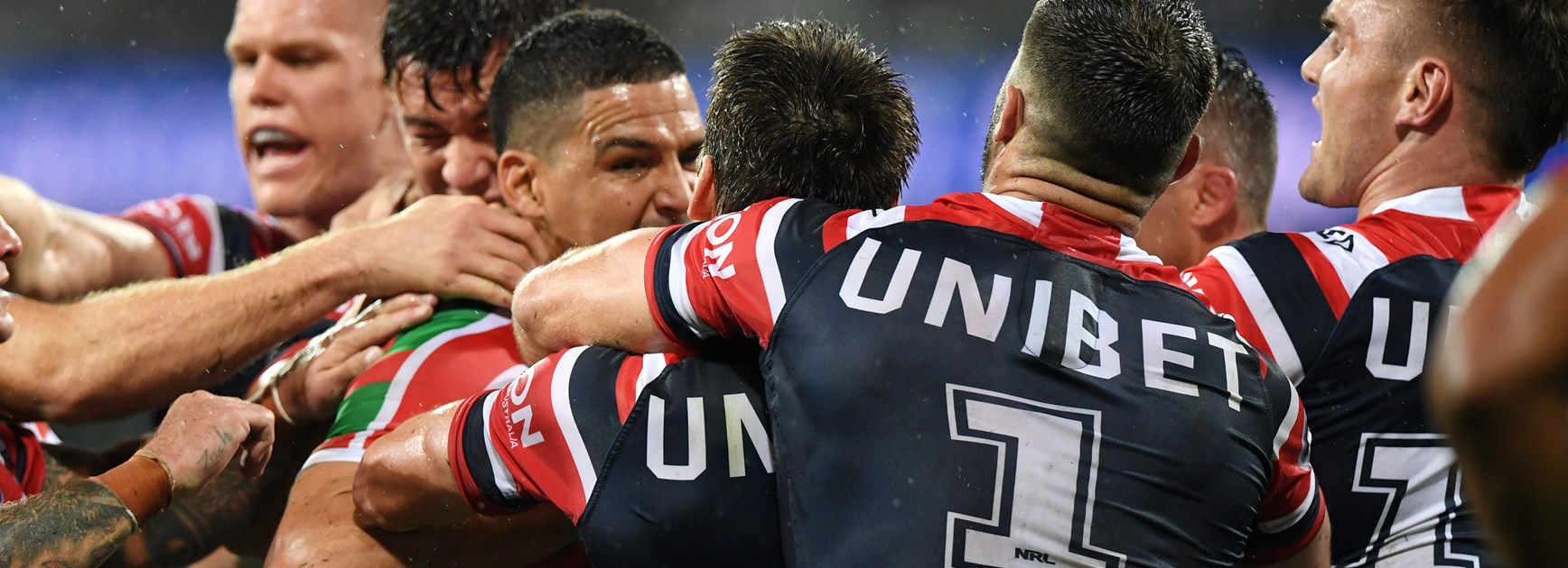 Rabbitohs five-eighth Cody Walker caught up in a melee with the Roosters.