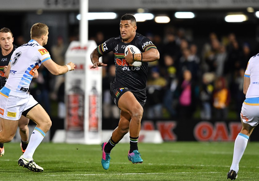 Viliame Kikau tries to make a break against the Titans.