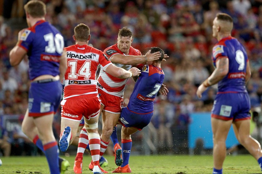 St George Illawarra forward Tariq Sims hits Knights halfback Mitchell Pearce.