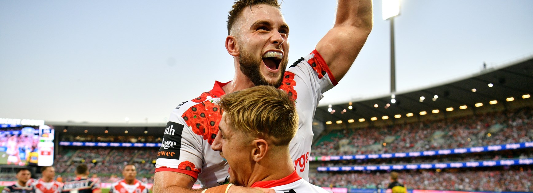 Dragons winger Zac Lomax is congratulated by Jacob Host.