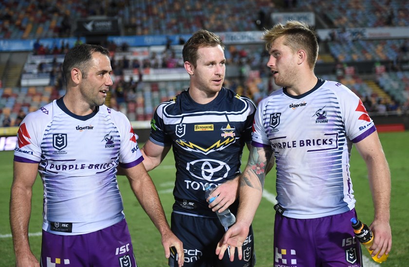 Cameron Smith and Cameron Munster flank Michael Morgan