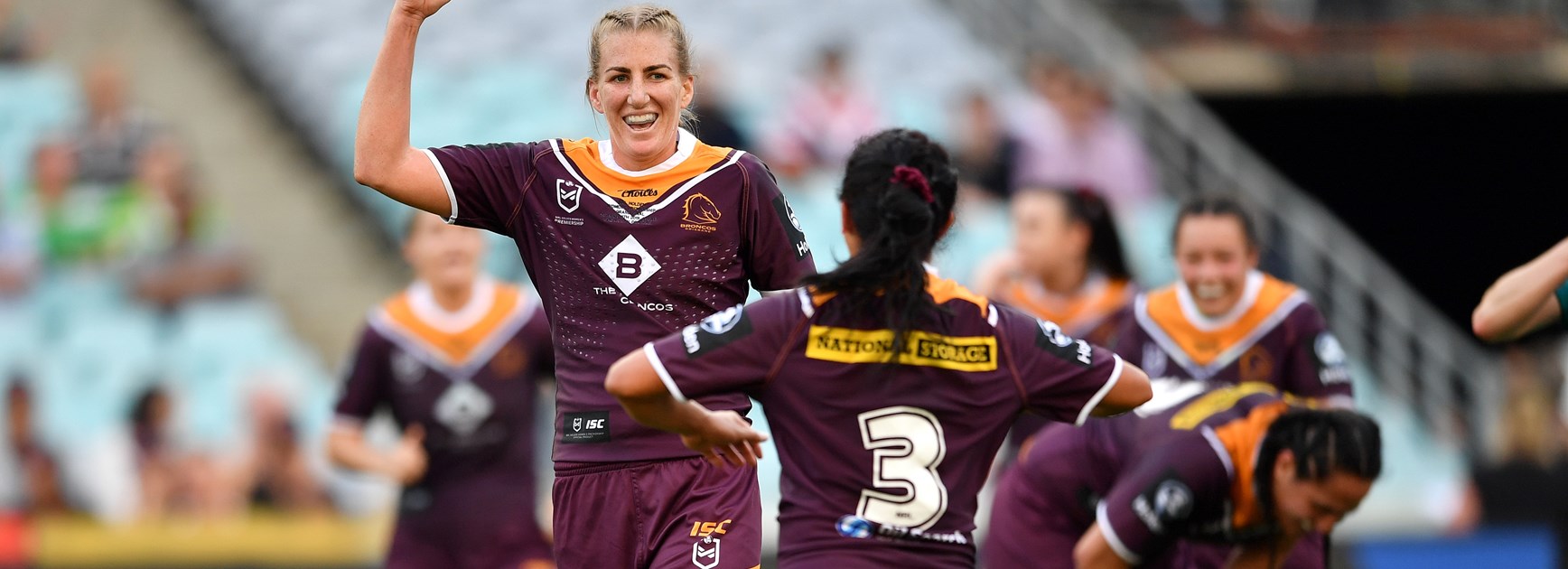 Ali Brigginshaw and Amy Turner celebrate the Broncos' 2019 grand final win.