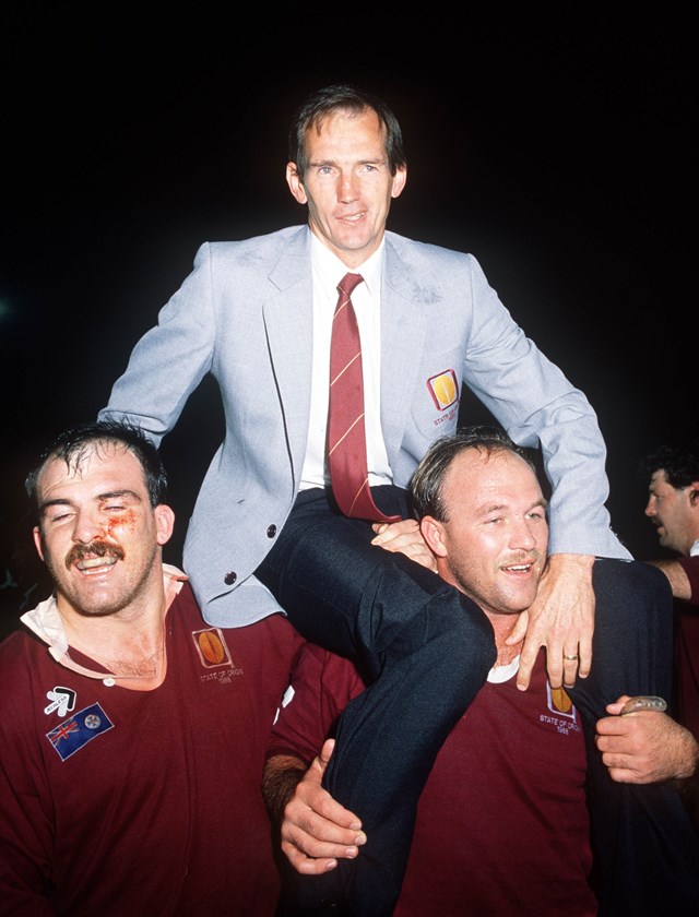 Martin Bella and Wally Lewis chair Wayne Bennett off Lang Park after Origin III in 1987.