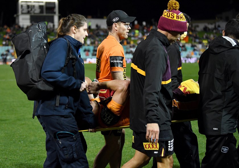 Broncos winger Corey Oates is taken from the field.