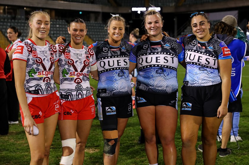 Tayla Preston (centre) with Sharks team-mates Ellie Johnston and Tegan Dymock and Dragons stars Teagan Berry and Zali Hopkins after their clash at WIN Stadium.