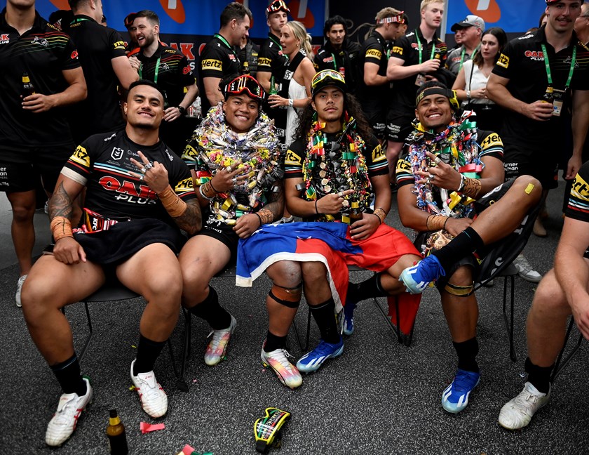 Spencer Leniu, Brian To'o, Jarome Luai and Stephen Crichton show of their collection of premiership rings after Penrith's 2023 triumph.