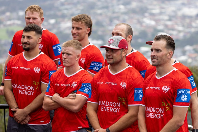 Clint Gutherson (front, right) and new Dragons team-mates after completing their run up Mount Keira.