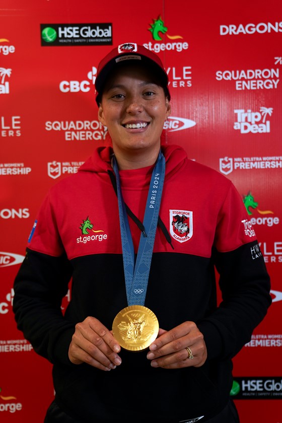 Tyla King shows off her Paris Olympics gold medal at Dragons training.