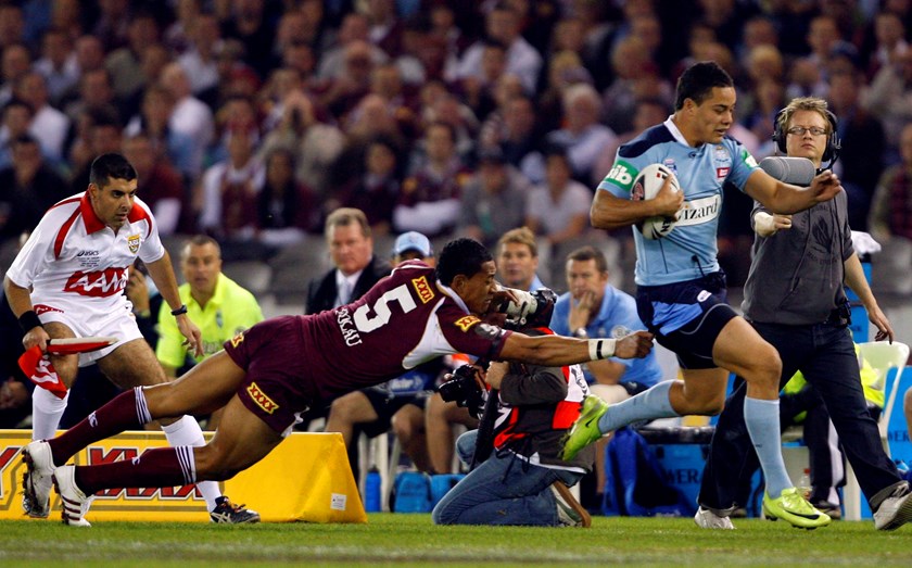 Jarryd Hayne skirts the sideline at Etihad Stadium in 2009